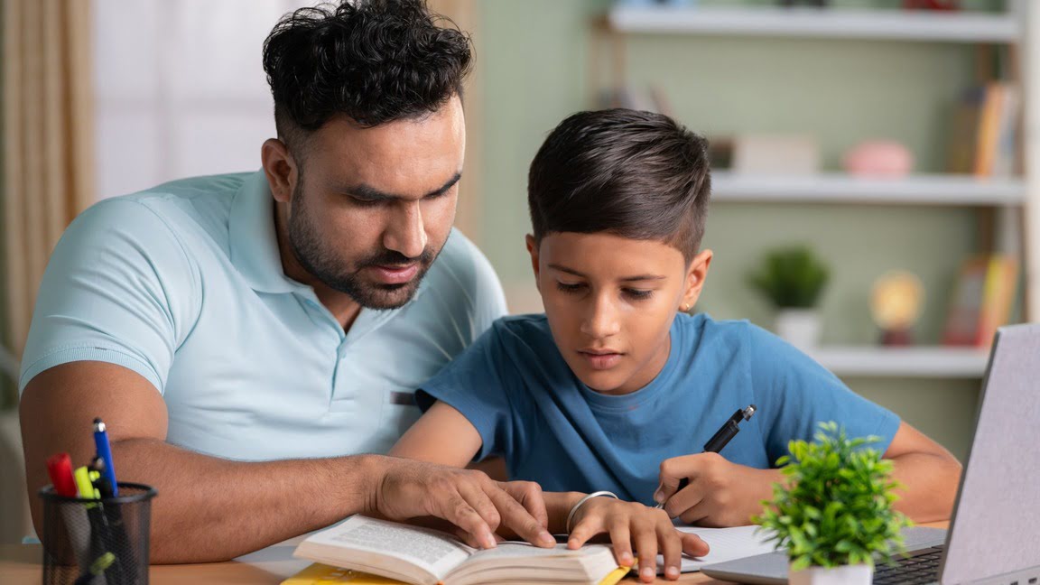 A father helping his child with homework.