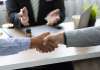 Two people shaking hands.