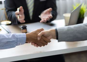 Two people shaking hands.