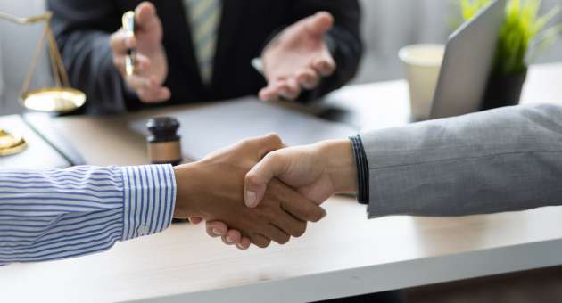 Two people shaking hands.