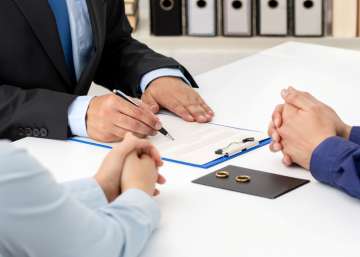 A divorcing couple with a lawyer.
