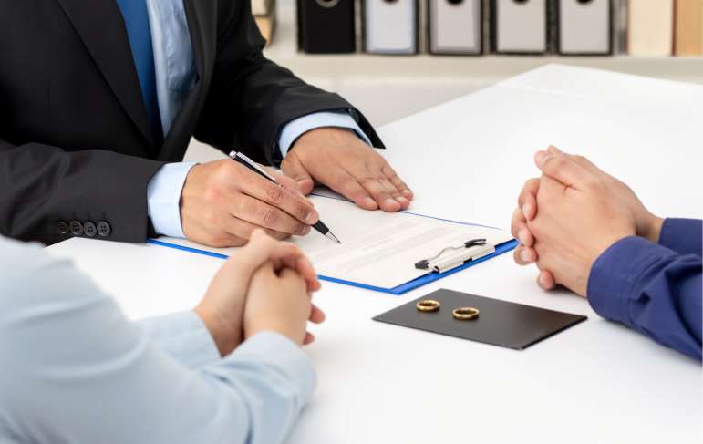 A divorcing couple with a lawyer.