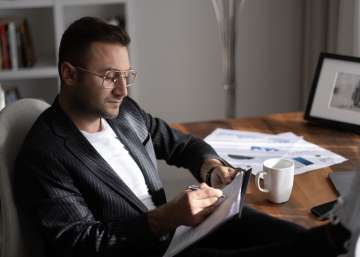 A man reading over documents.