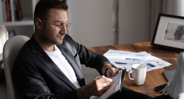 A man reading over documents.