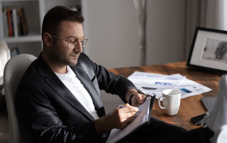 A man reading over documents.