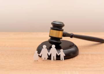 Paper family cutout with a gavel.