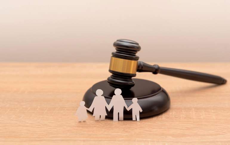 Paper family cutout with a gavel.